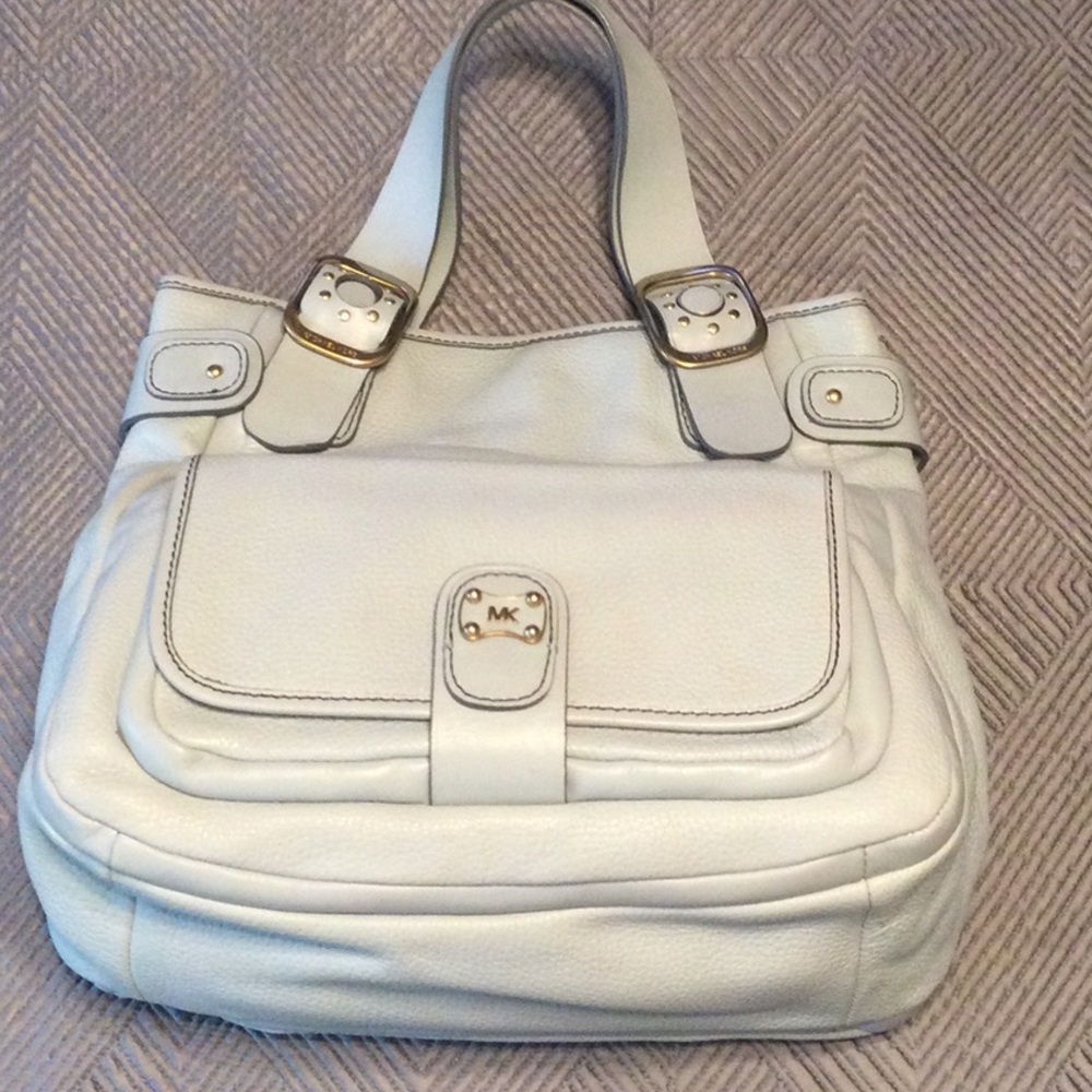 Michael Kors blue pebble leather satchel with canvas lining and 6  pocket.